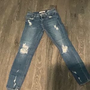 Distressed denim jeans